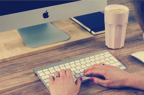 Woman's hands on computer keyboard